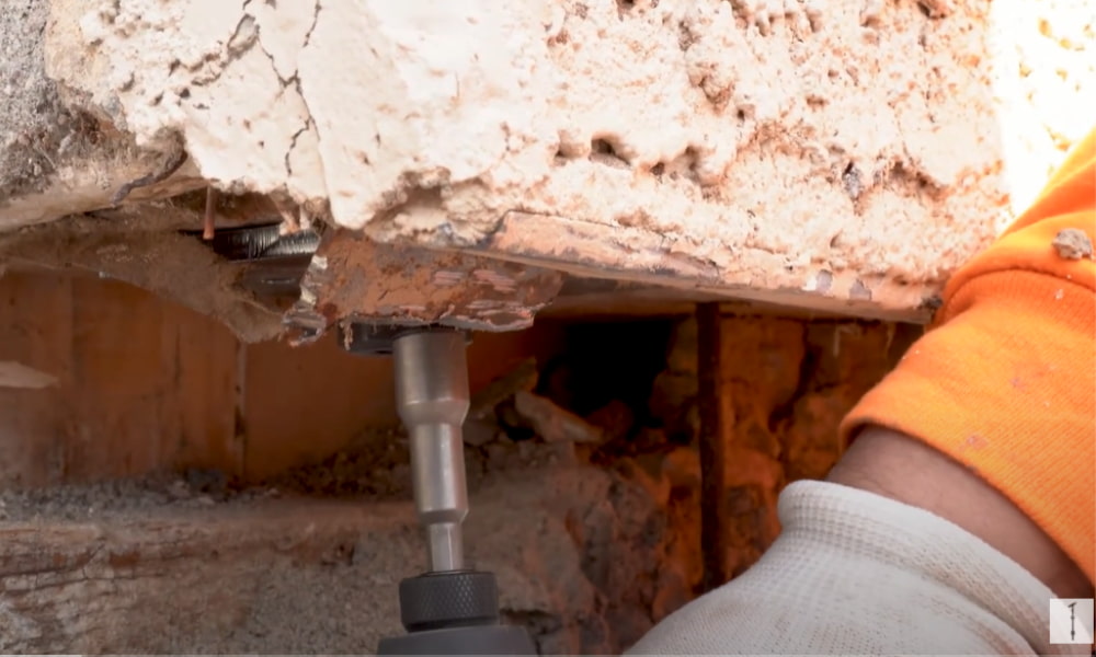 Anchor bolts installed along concrete foundation during cost estimate visit