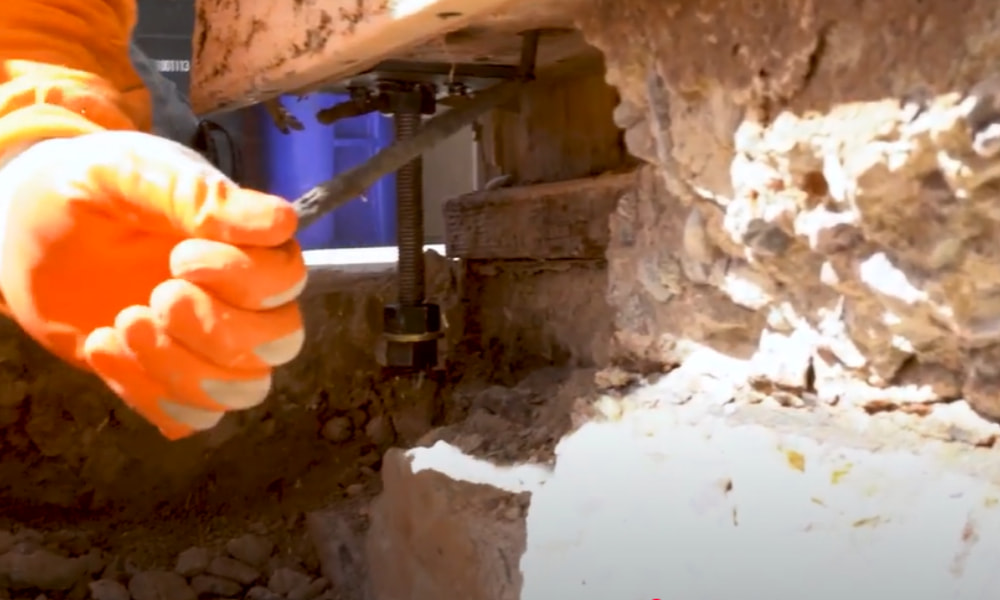 Existing concrete foundation being retrofitted with new anchor bolts