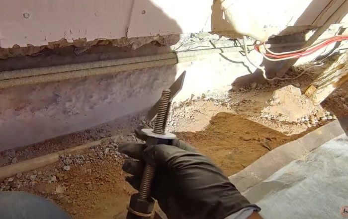 Upgraded anchor bolts improving home foundation safety and insurance value